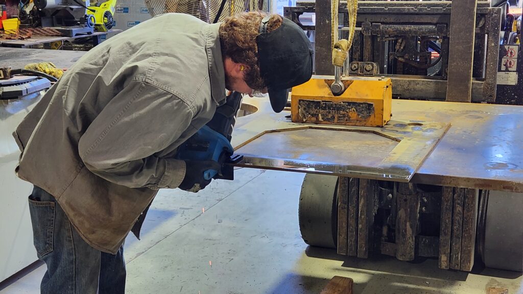 A person steel waterjet cutting some structural parts in San Diego.